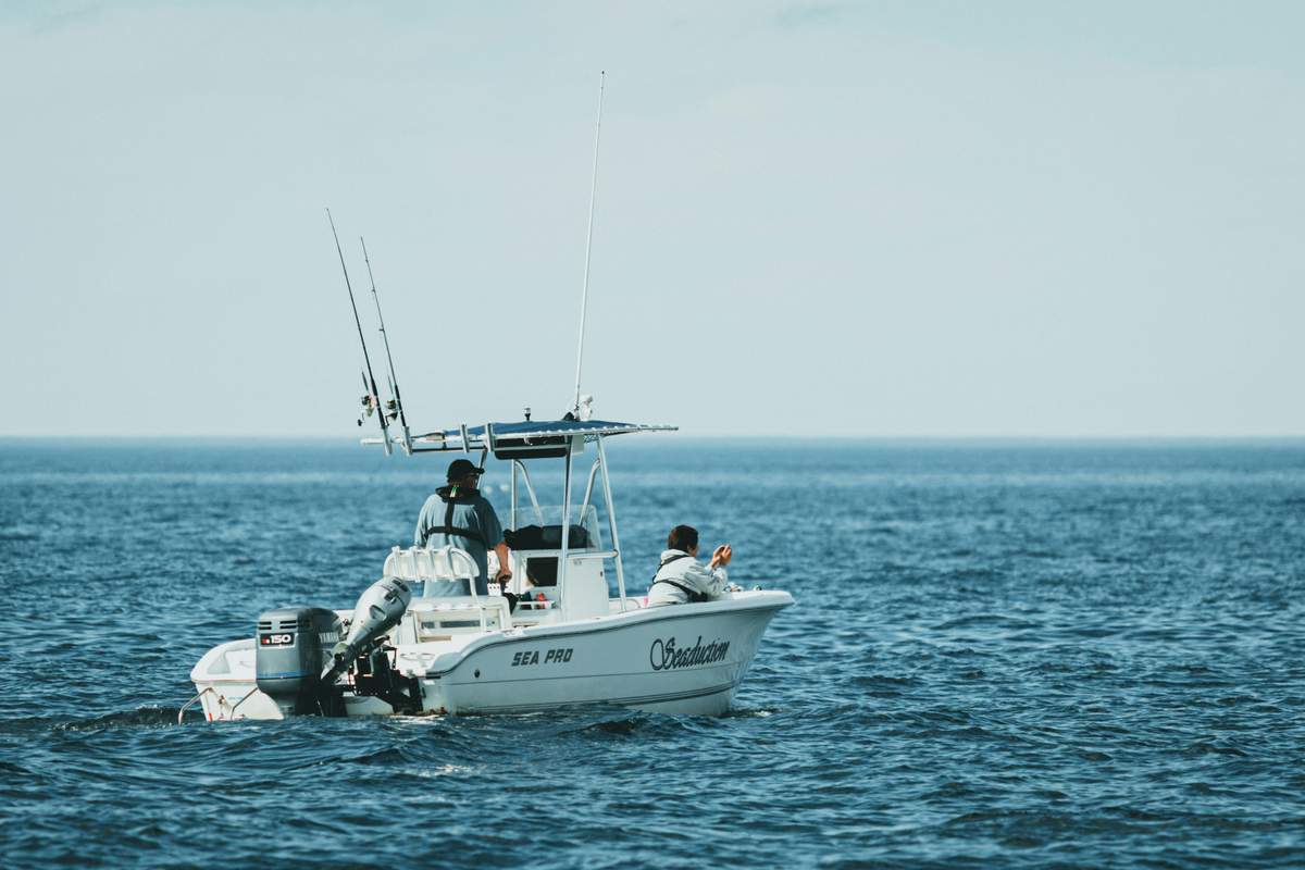 Sport fishing boat in action with fishing rods set up for deep sea fishing off St. John USVI