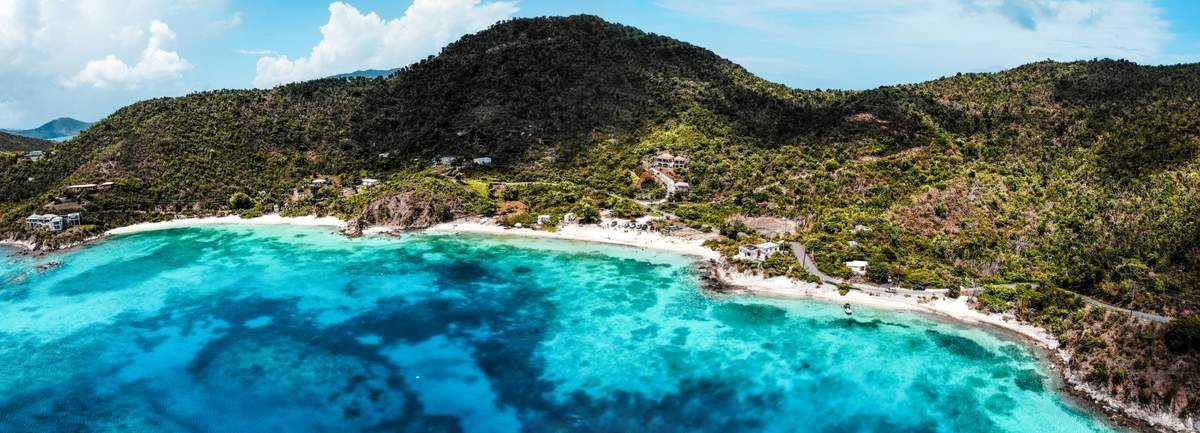 Tropical scene in the US Virgin Islands on a cloudy day with lush green hills